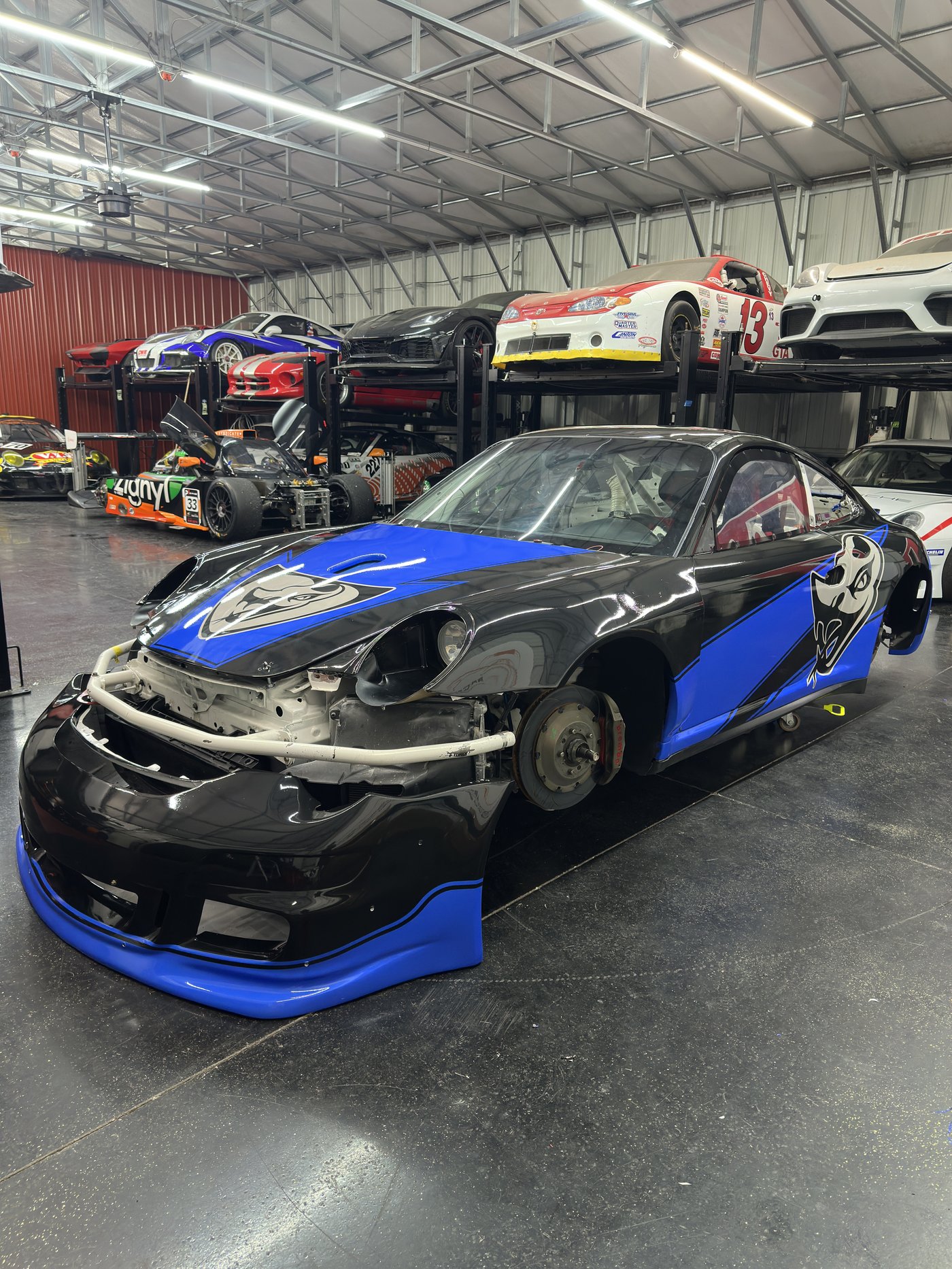 Porsche 911 race car in garage